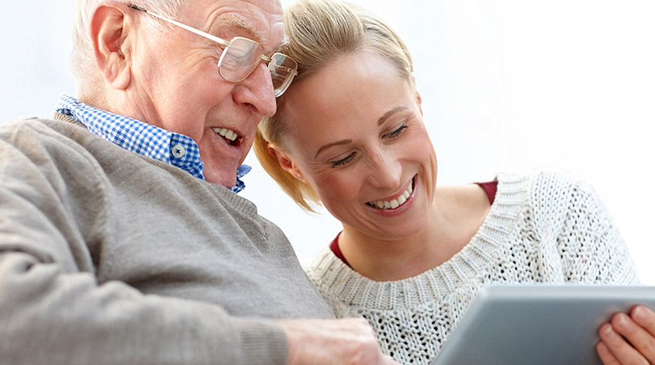 Elderly man enjoying time with a caregiver