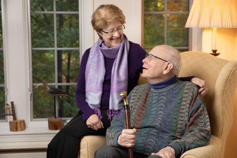 A couple of residents enjoying conversation in a cozy living area