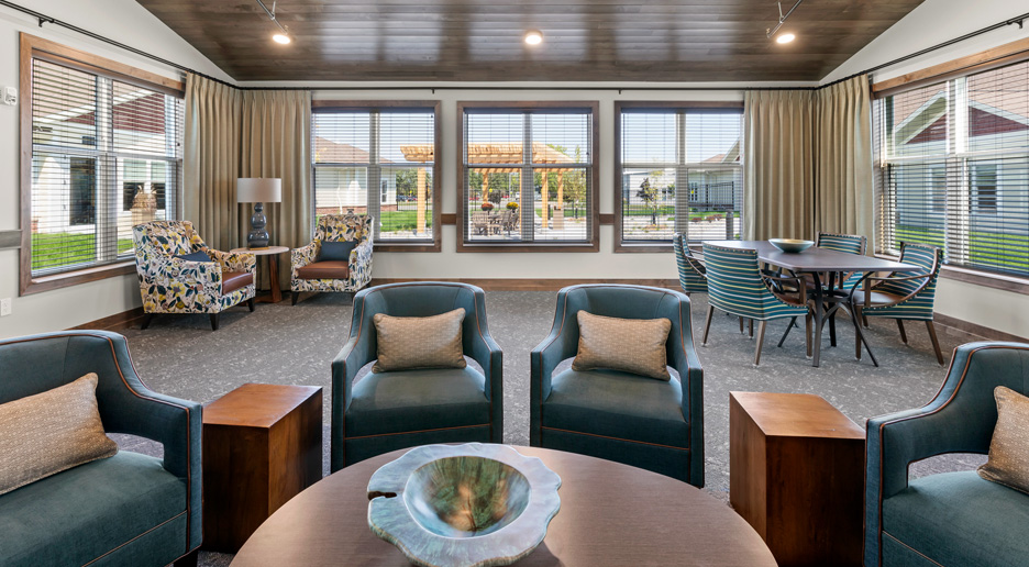 Interior of a common area with comfortable seating and large windows