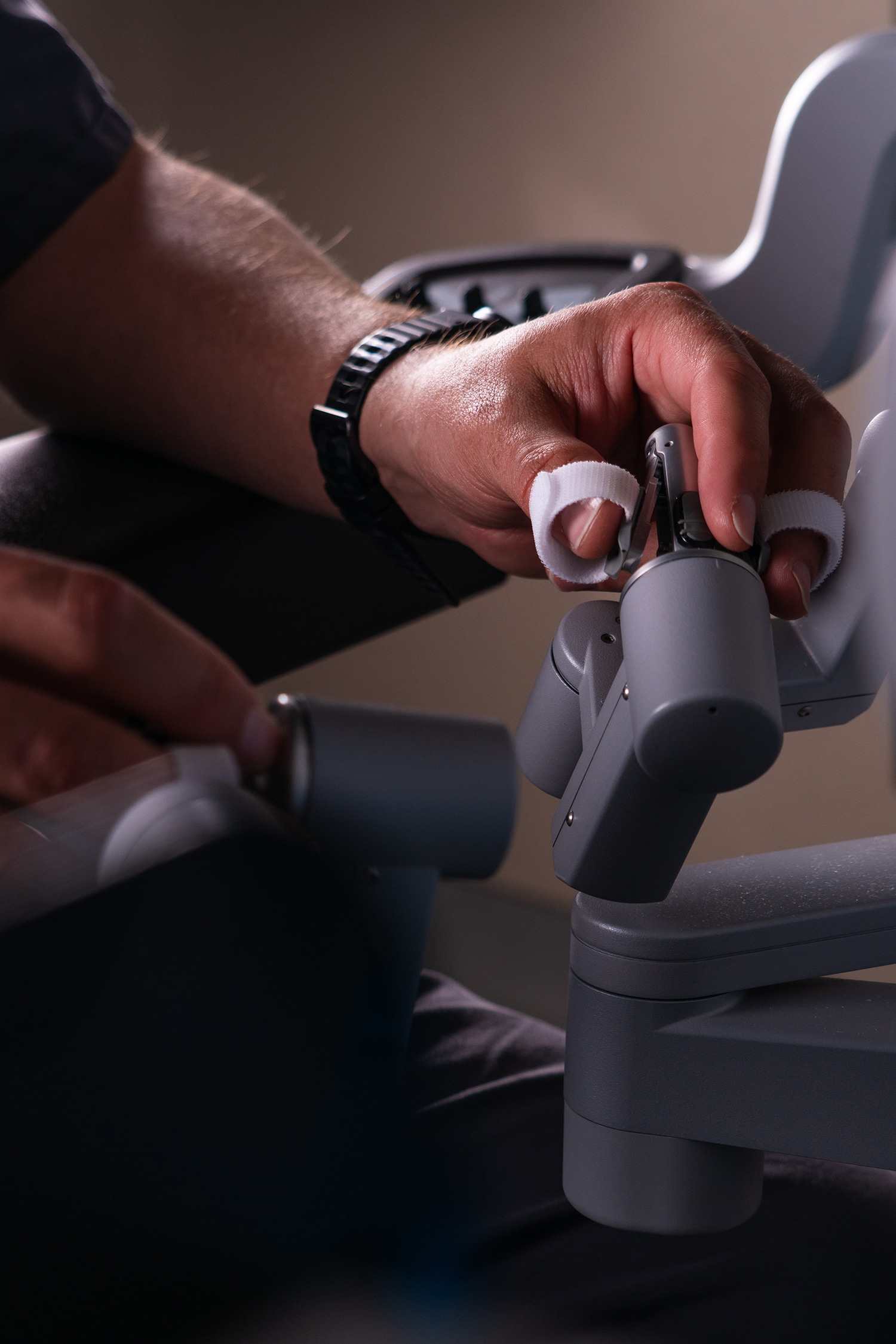Close-up of a hand adjusting a device