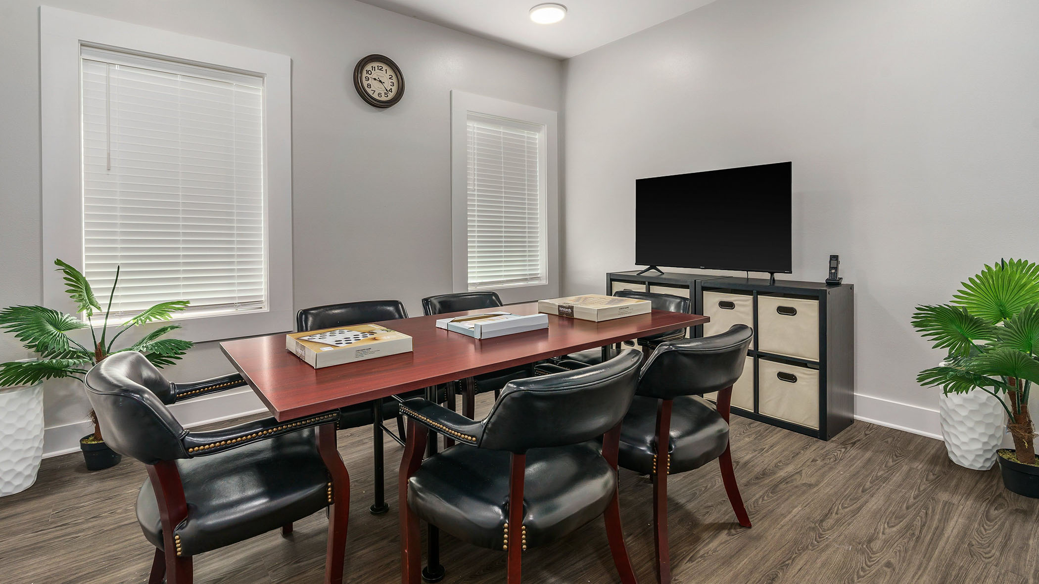 Interior meeting room with a table and chairs