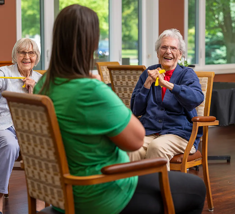 Residents engaging in an activity session with staff