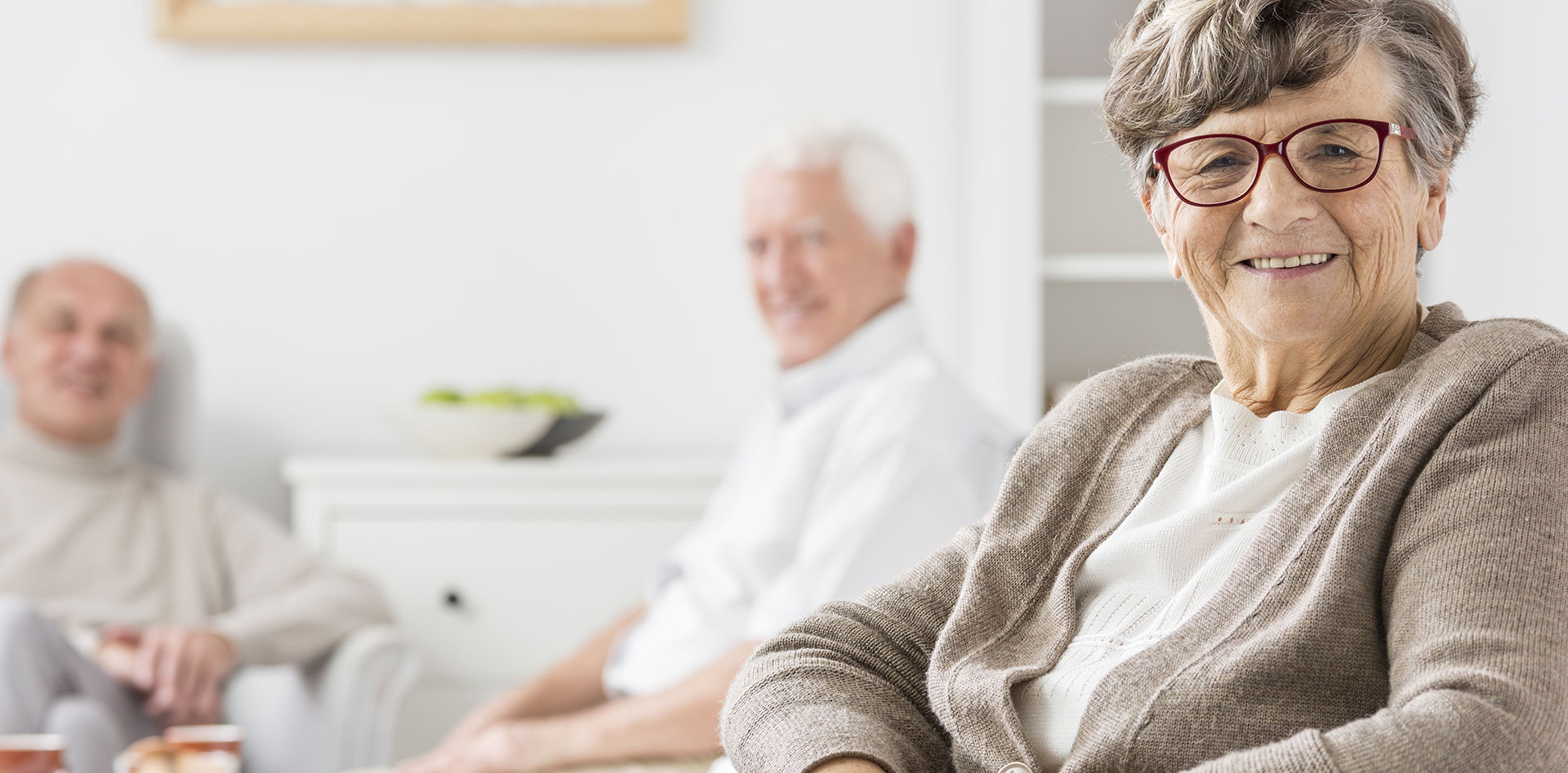 Residents smiling and socializing in a common area
