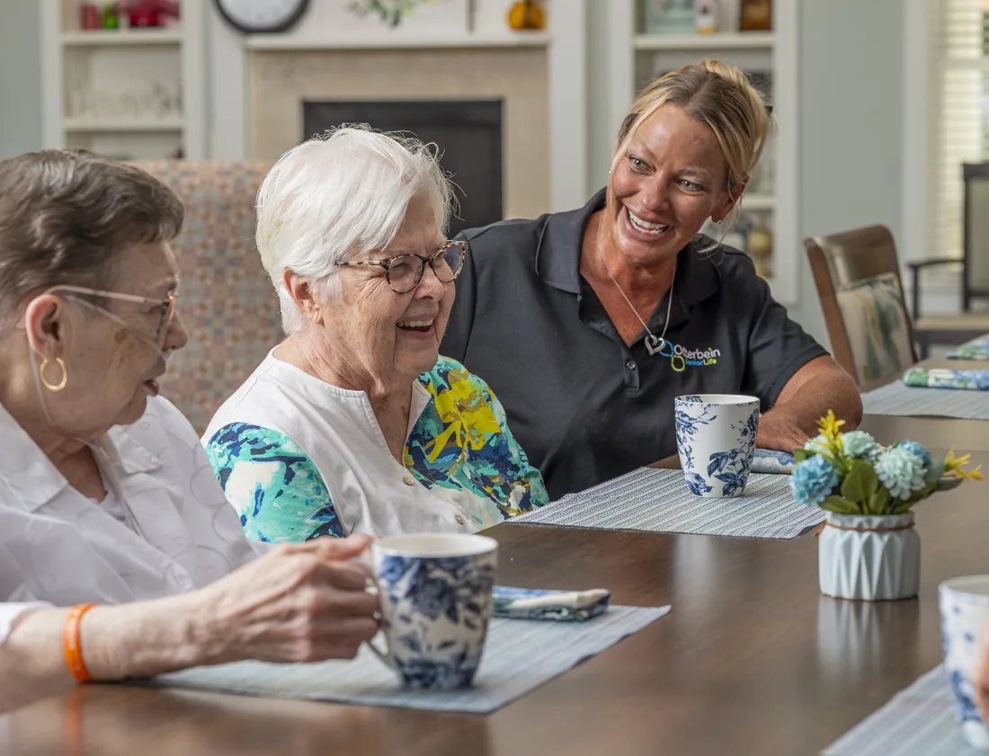 Residents enjoying coffee in a common area