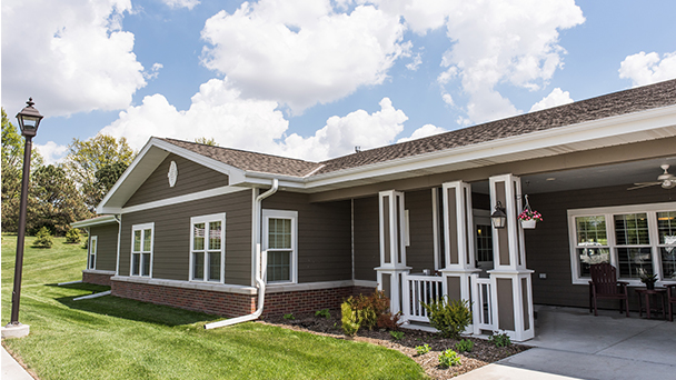 Exterior view of a senior living facility with landscaping