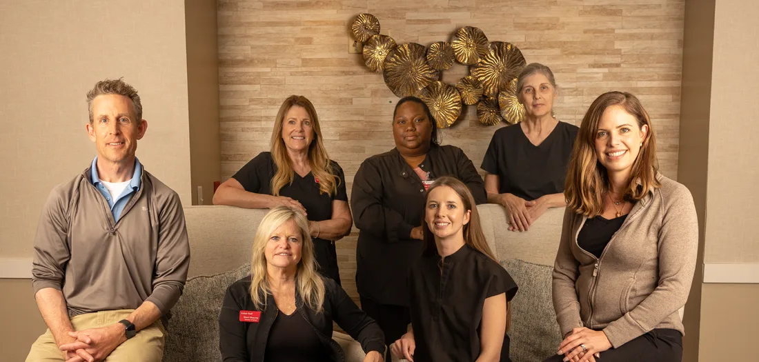 Staff members posing in a common area