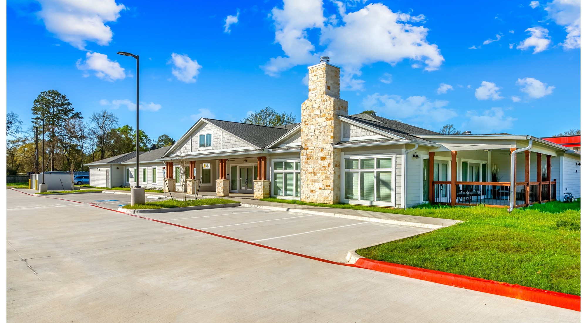 Exterior view of the assisted living facility with landscaped areas