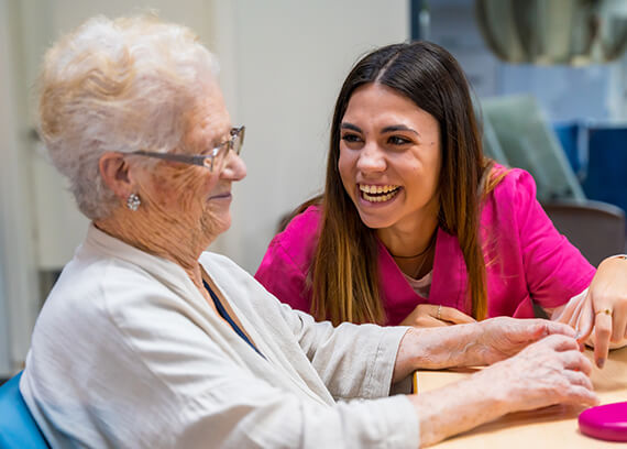 Resident and staff member engaging in conversation