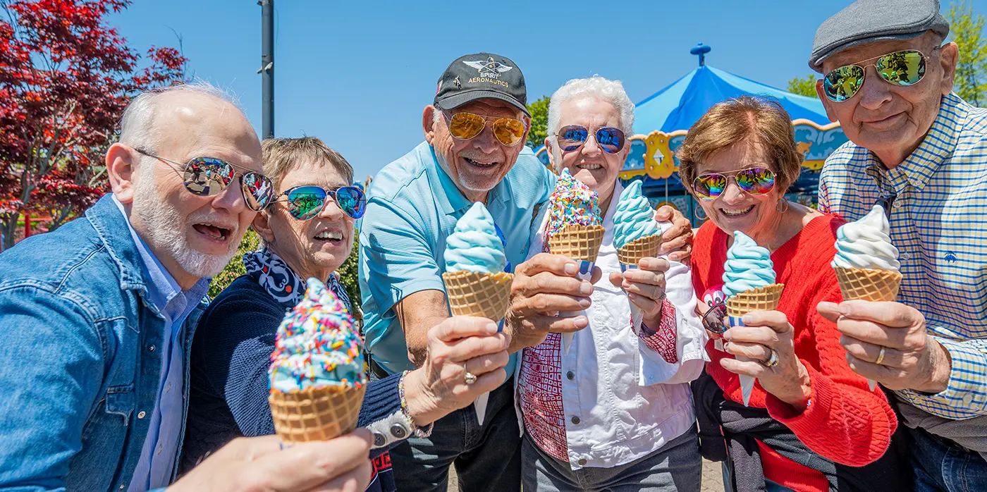 Residents enjoying ice cream outdoors on a sunny day