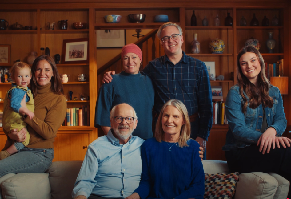 A group of residents and family members sitting in a cozy living room