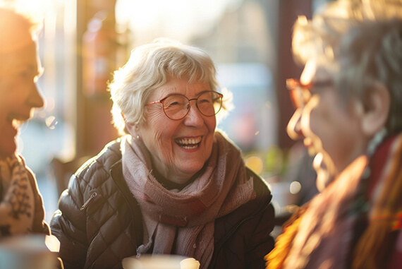 Seniors enjoying a joyful conversation in a cozy setting
