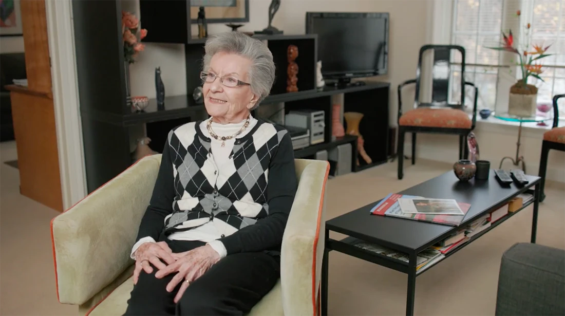 A resident sitting comfortably in a living room.