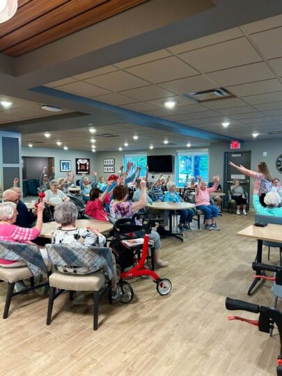 Residents participating in a joyful activity in the common area
