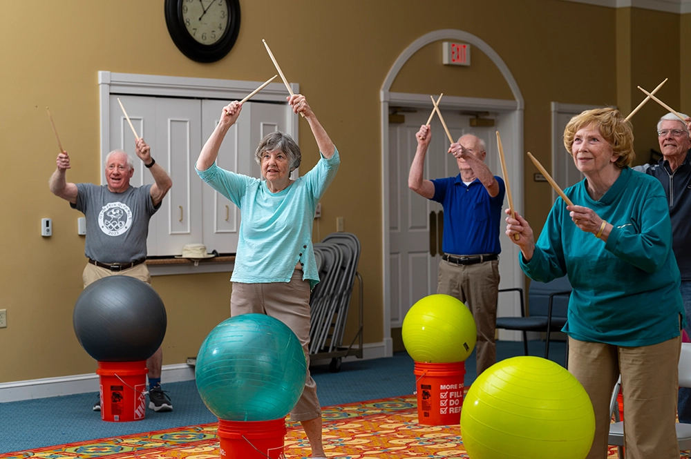 Residents participating in a group activity with exercise balls