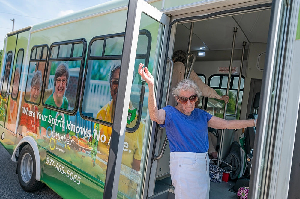 Resident exiting facility transport bus