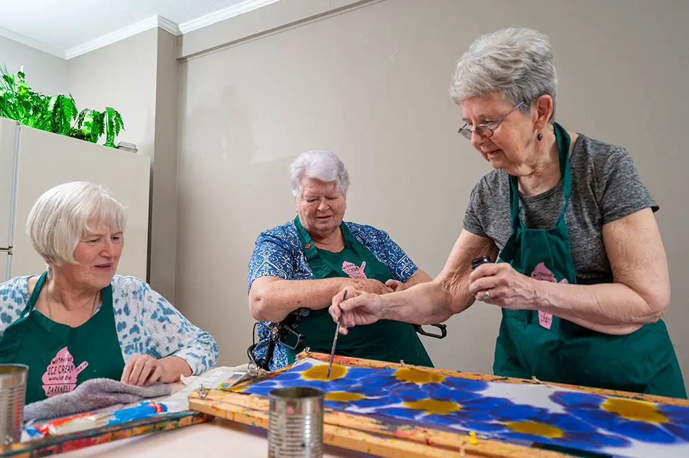 Residents engaged in a painting activity
