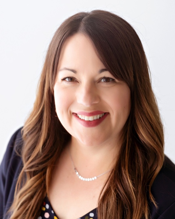 A smiling woman with long brown hair