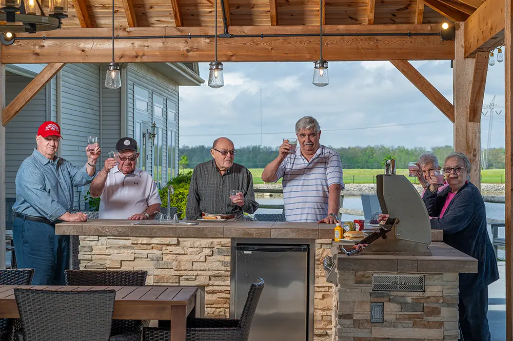 Residents enjoying a toast in an outdoor area