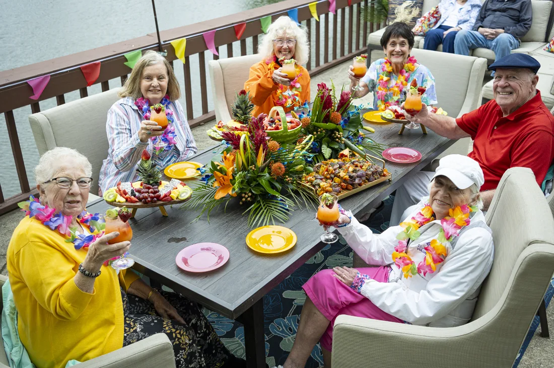 Residents enjoying drinks at an outdoor celebration