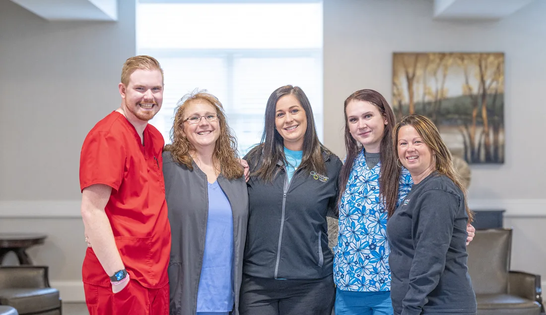 Facility staff members posing together