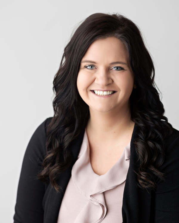 Close-up portrait of a staff member smiling