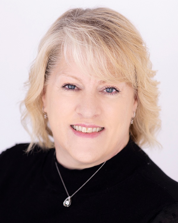 Portrait of a smiling woman with light hair