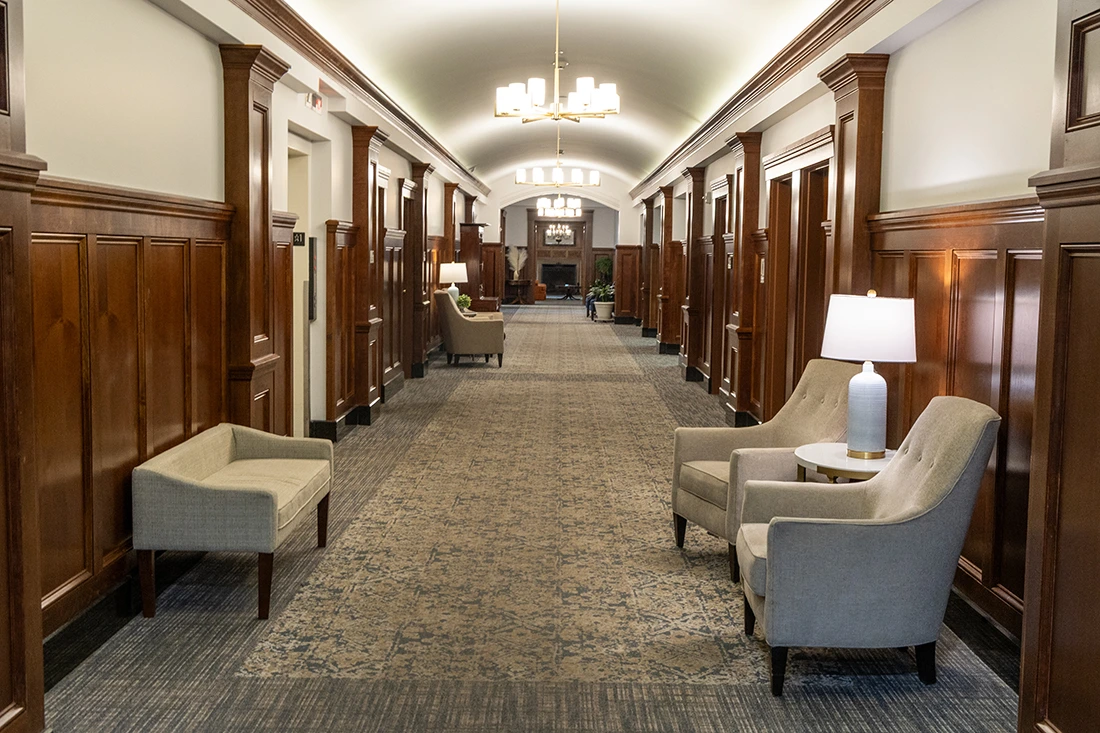 Well-lit hallway in a senior living facility