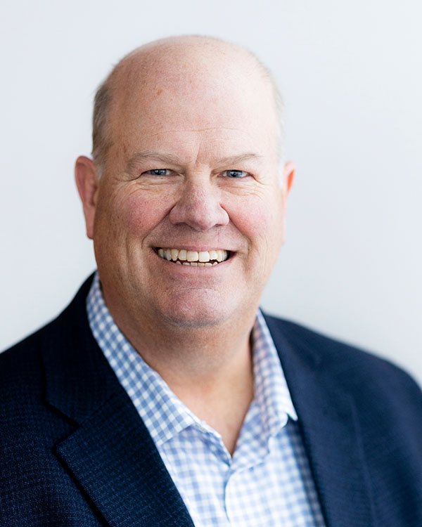 Smiling man in a blazer