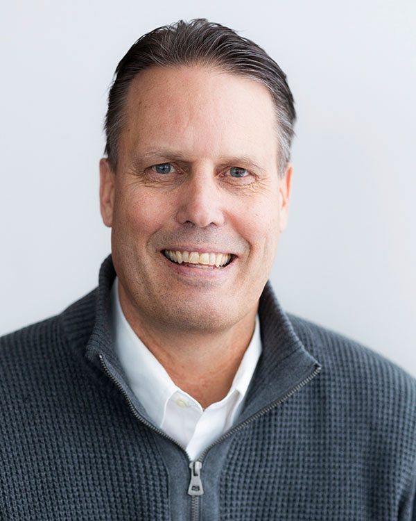 Man smiling in a casual environment