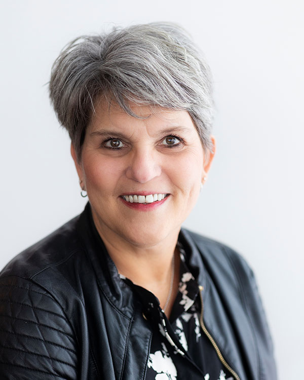 Portrait of a smiling woman in a leather jacket