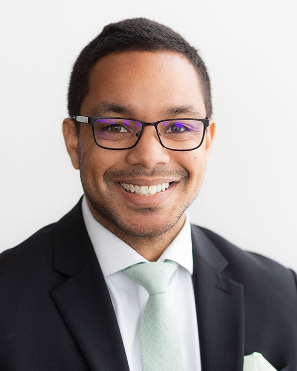 Smiling staff member in formal attire