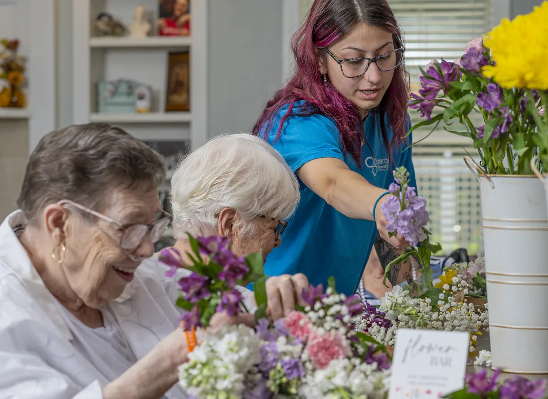 Residents participating in a flower arranging activity