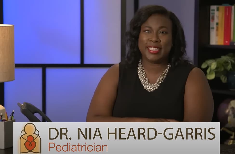 Pediatrician Dr. Nia Heard-Garris speaking in an office