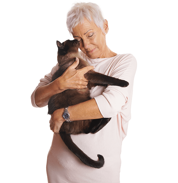 Senior woman holding a cat in a caring embrace