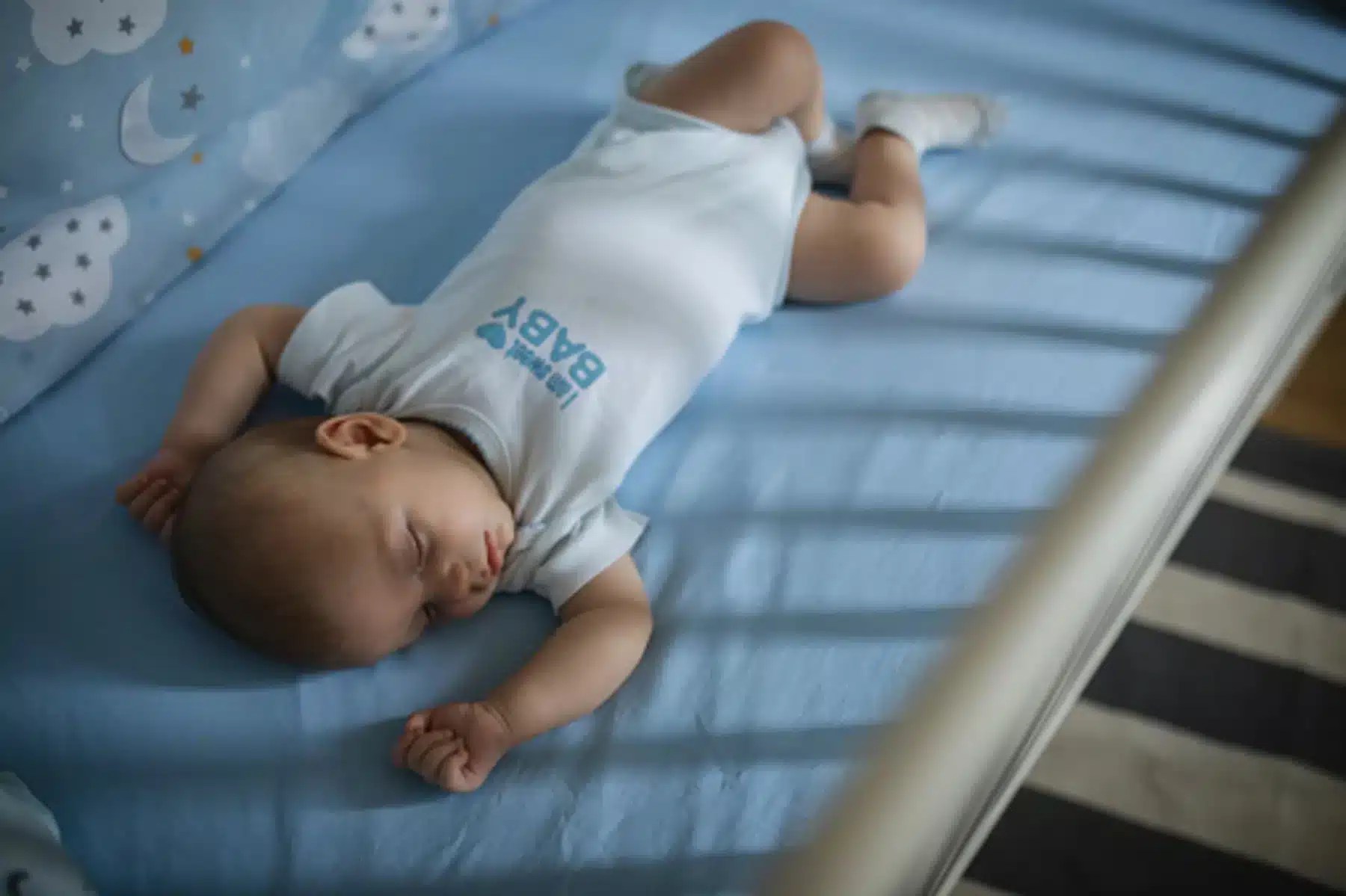 A baby sleeping in a crib