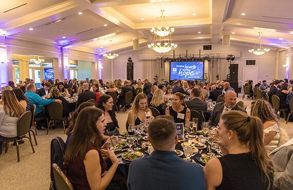 Guests enjoying a formal dining event in a banquet hall