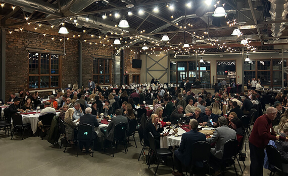 Residents and guests enjoying a large dining event