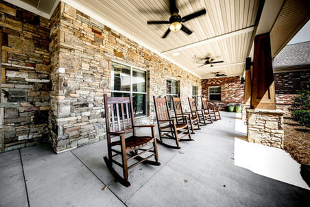 Outdoor rocking chairs on a porch area