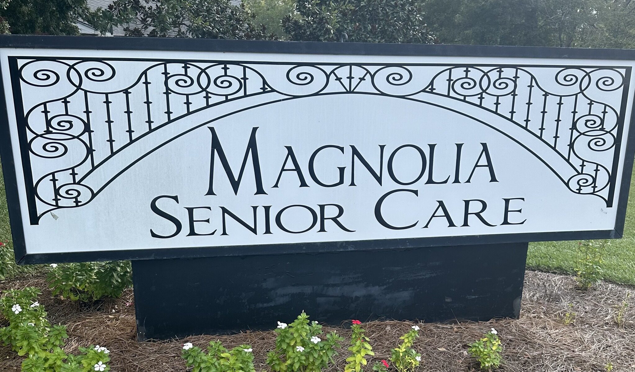Facility sign with name Magnolia Senior Care