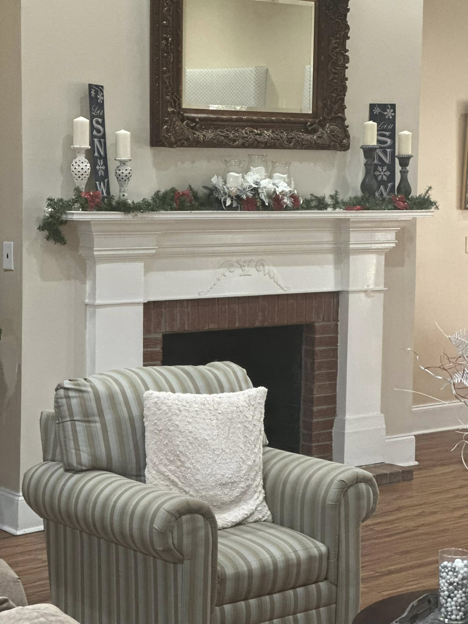 Decorative lounge area with a fireplace and armchair