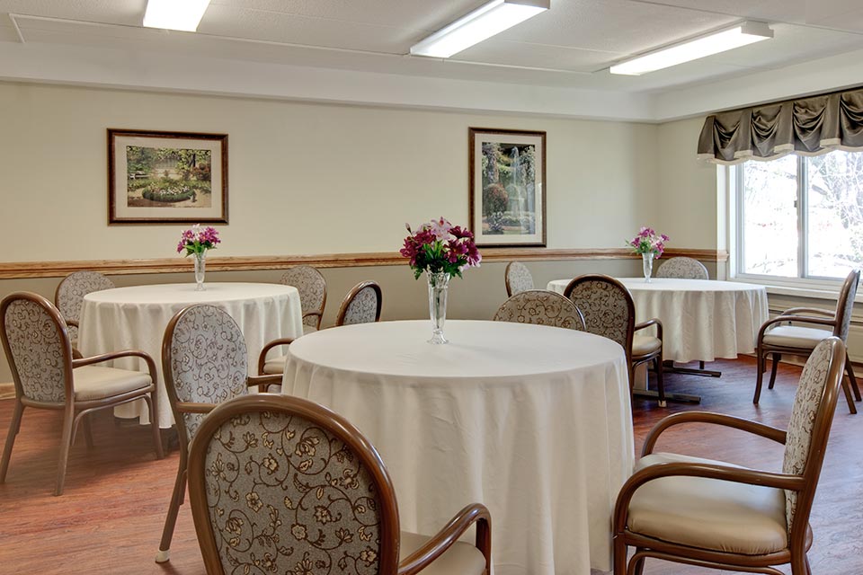 Interior view of a living area with tables and flowers