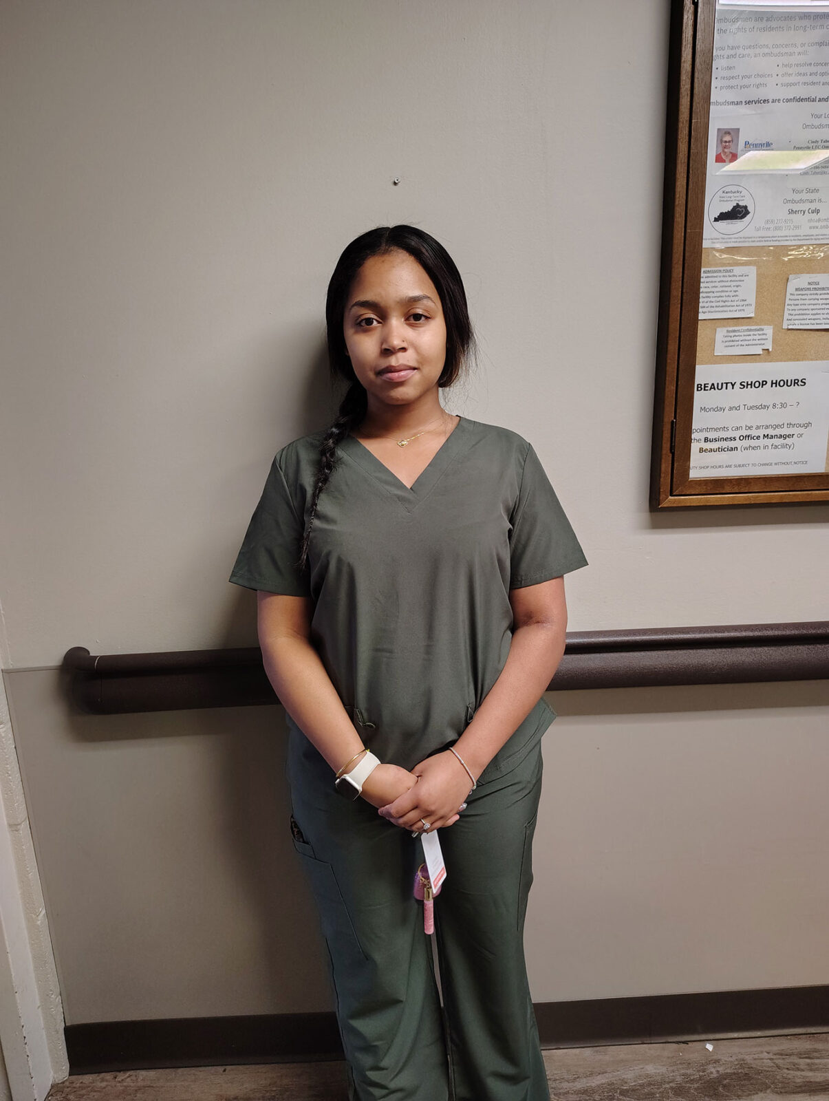 Staff member in uniform standing indoors
