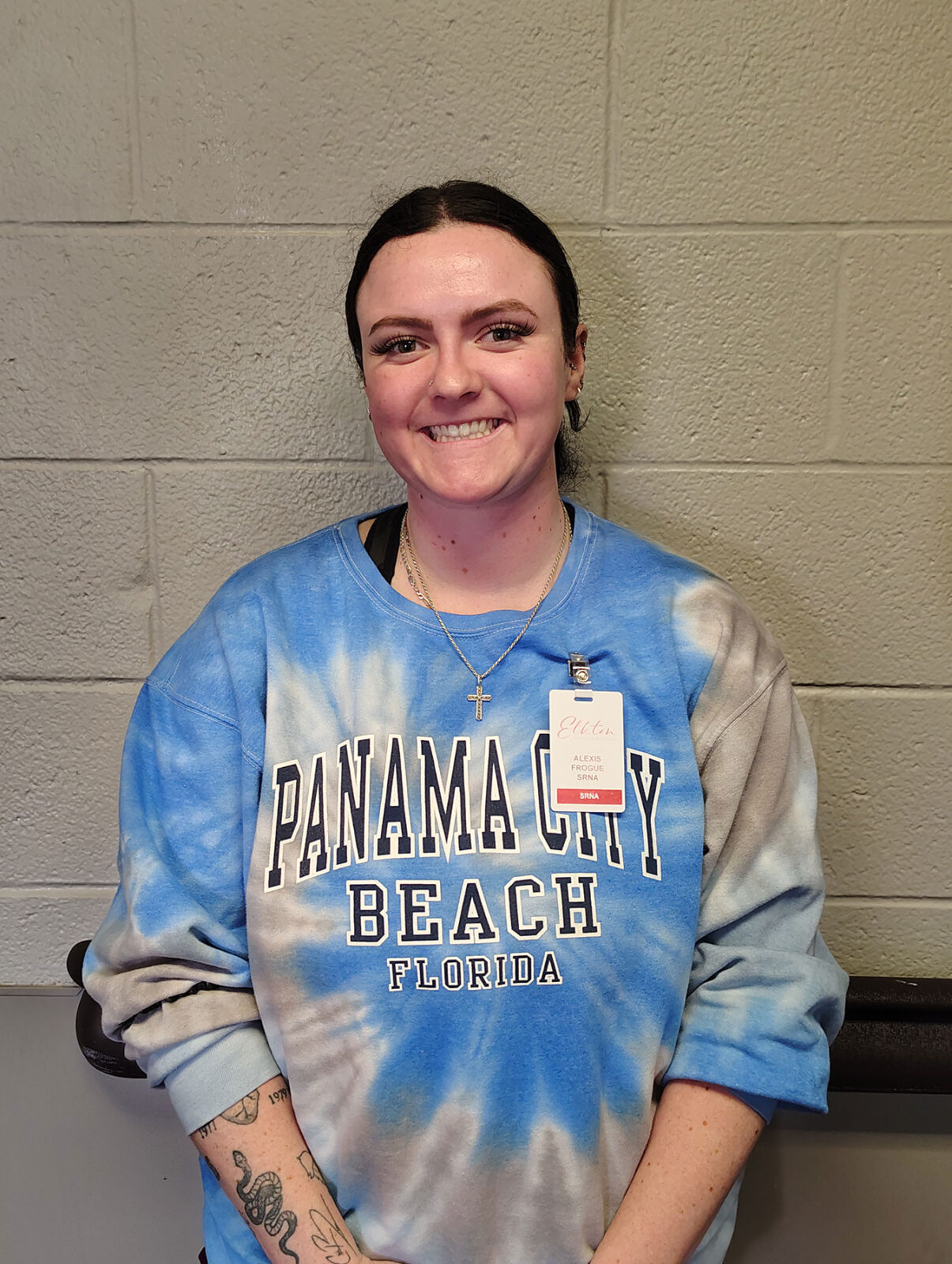 Staff member smiling in facility hallway