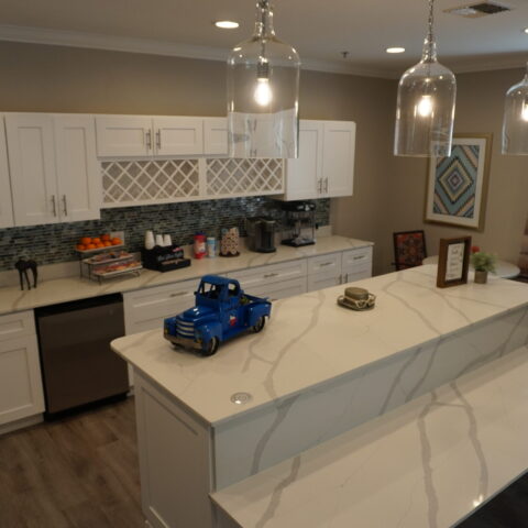Modern kitchen with decorative elements and turquoise accents.
