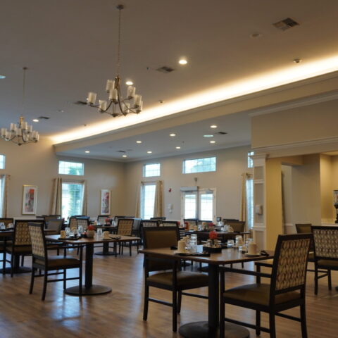 Bright dining area with tables set for meals.