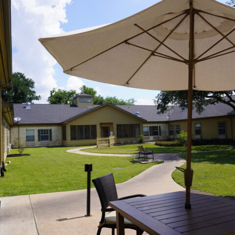 Outdoor patio area with table and chairs