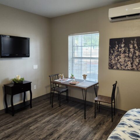 Cozy interior of a resident's room with table and chairs