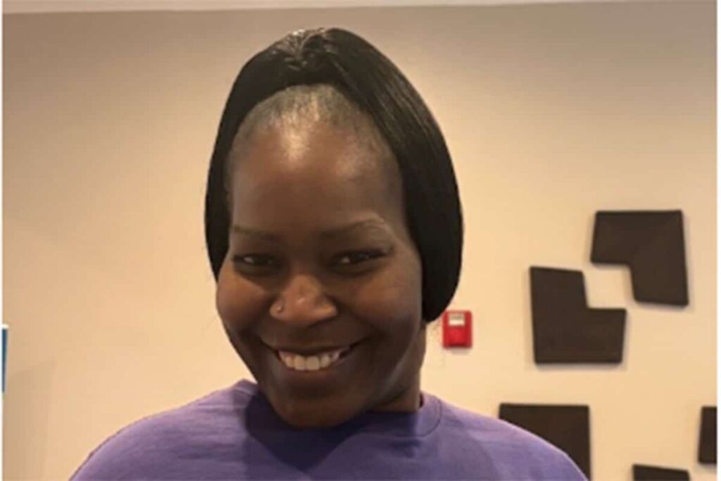 Smiling staff member in a facility setting