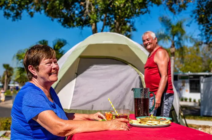 Older adults enjoying a meal outdoors