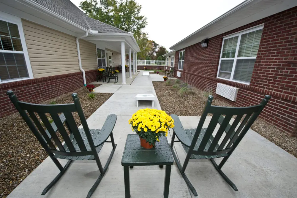 Outdoor seating area with potted flowers